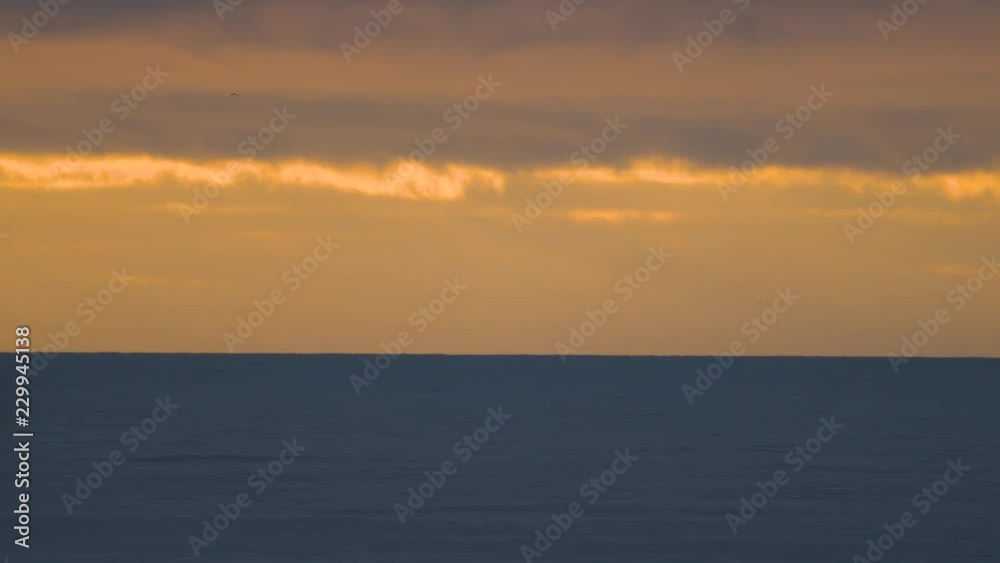 Gentle Waves Rolling in During a Golden Sunset on the Oregon Coast Gentle Waves Rolling in During a Golden Sunset on the Oregon Coast