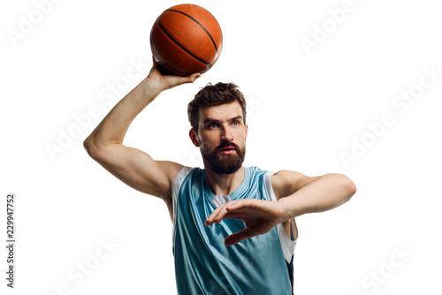 Aiming basketball player on white