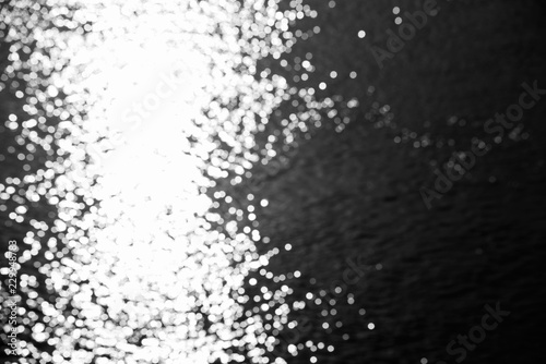Abstract blurred background with night water and round bokeh, photo