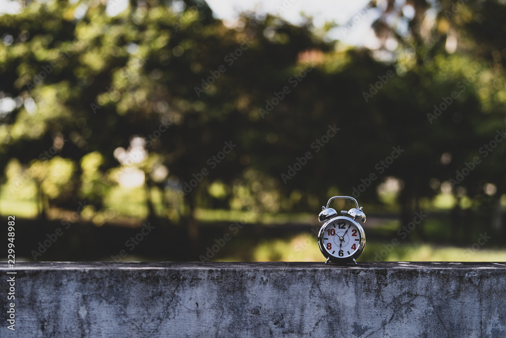 Naklejka premium Retro Alarm Clock with bokeh