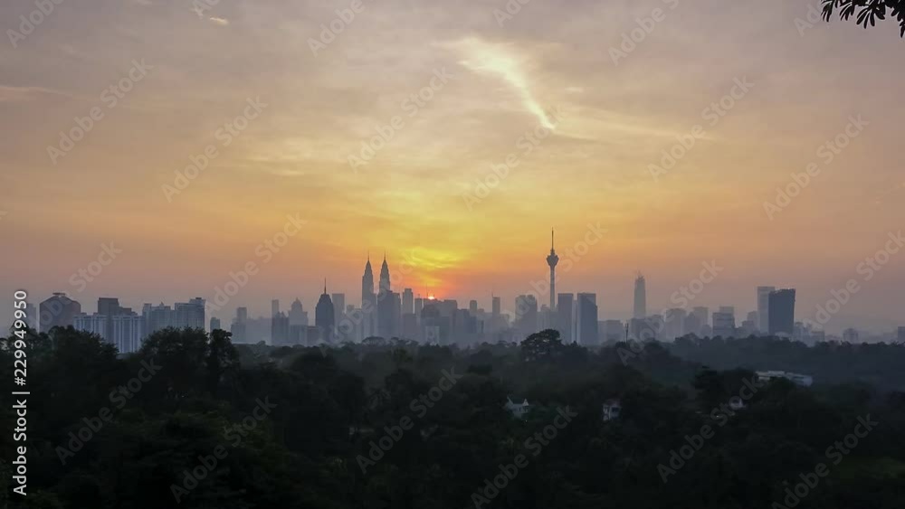 Kuala Lumpur City skyline basking under the warm glow of golden light and beautiful rays during sunrise. Wide angle shot
Kuala Lumpur City skyline basking under the warm glow of golden light and beautiful rays during sunrise. Wide angle shot