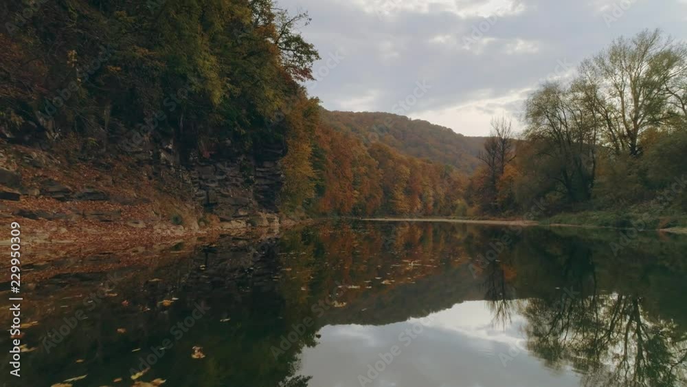 Aerial view: Flying over the river. Incredible autumn landscape Aerial view: Flying over the river. Incredible autumn landscape