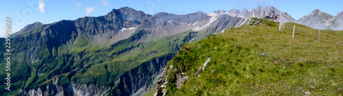 panorama mountain landscape in the Swiss Alps above Bad Ragaz with a great view of the Pizol mountains and hikers in the distance photo