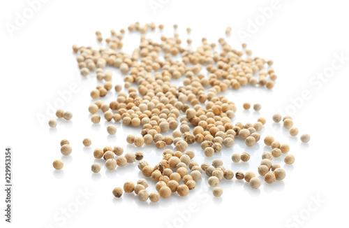 Pepper grains on white background. Natural spice