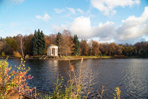 Gazebo-rotunda on the banks of the Swan pond in the autumn. photo