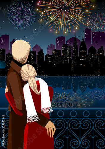 Couple watching firework display at night