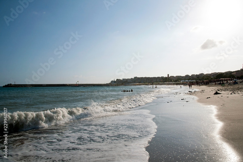 People on the beach at a windy evening