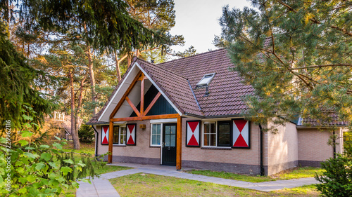 Cozy little holiday home with colorful classic wooden shuttered windows