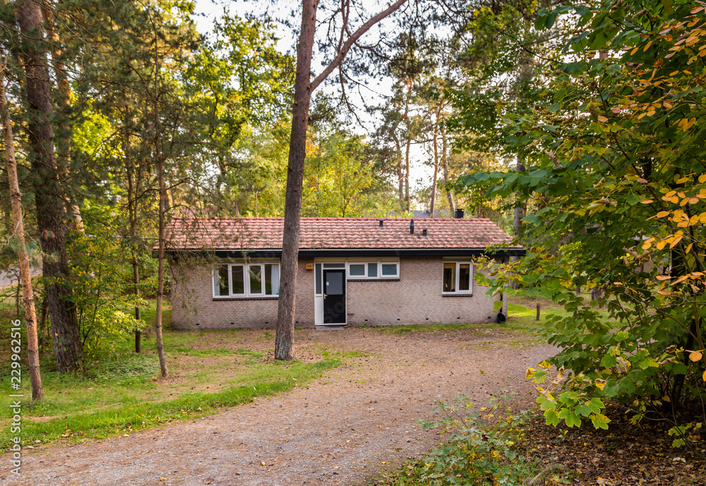 Cozy little holiday home with colorful classic wooden shuttered windows Cozy little holiday home with colorful classic wooden shuttered windows