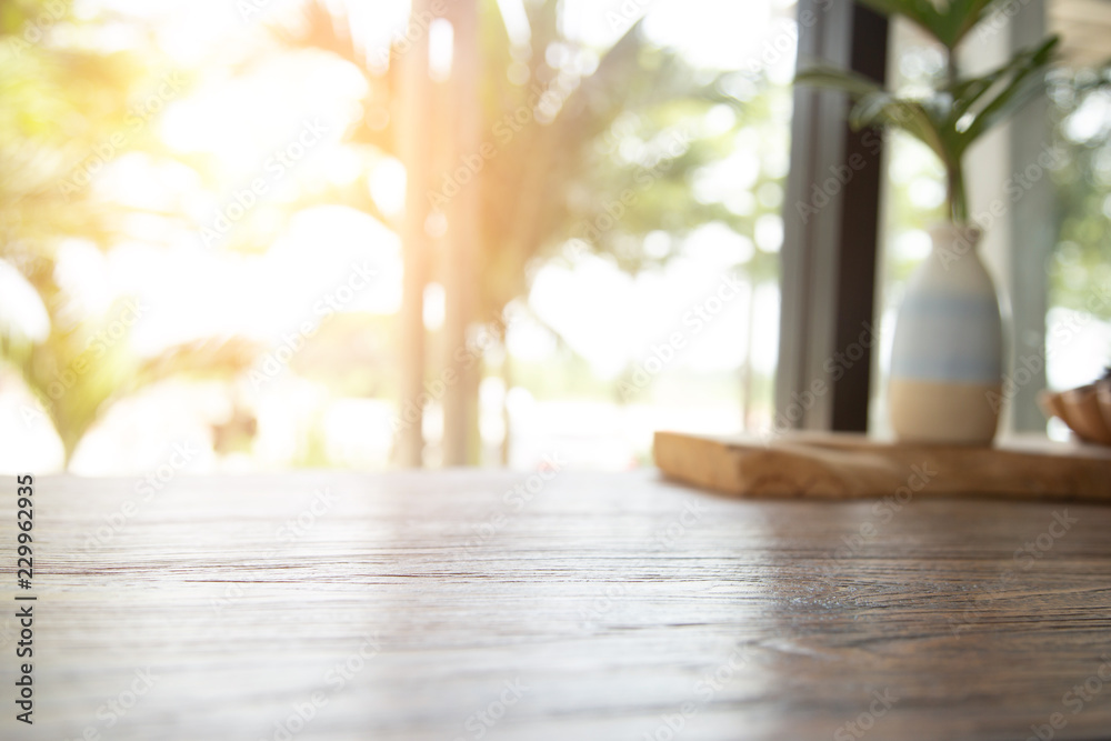 Empty wooden table abstract blurred background of windows coffee shop.used for display or montage your products.Mock up for display of product Empty wooden table abstract blurred background of windows coffee shop.used for display or montage your products.Mock up for display of product