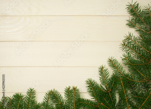 Christmas tree framework branches on wooden background with copy space. Horizontal template for design