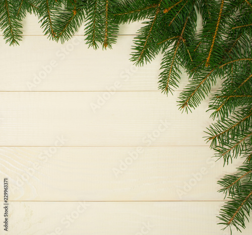 Christmas tree framework branches on wooden background with copy space. Horizontal template for design