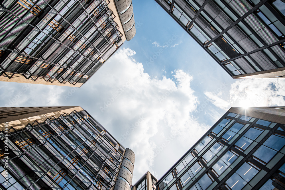 Naklejka premium Apartment houses with cloudy sky