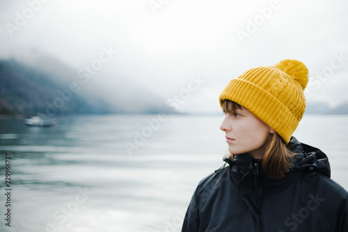 Portrait of a woman exploring a lake in Patagonia photo