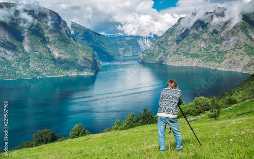 Young photographer directs focus photo