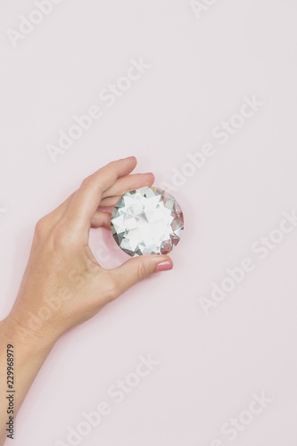 Hand holding a big diamond