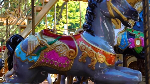 Retro vintage colorful circus carousel animal merry go round horse ride spinning in kids amusement park carnival funfair