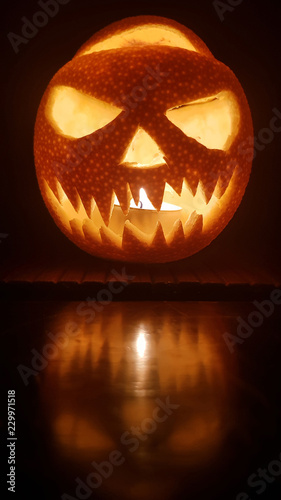 Halloween pumpkin scary smile for party night on dark background