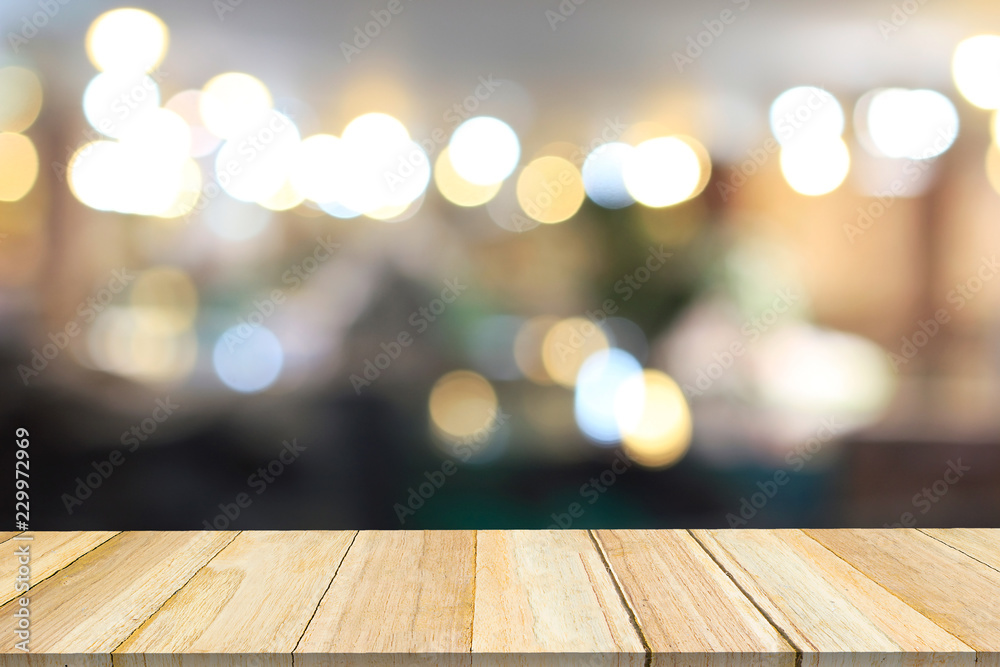 Perspective wood and blurred cafe with bokeh light background.