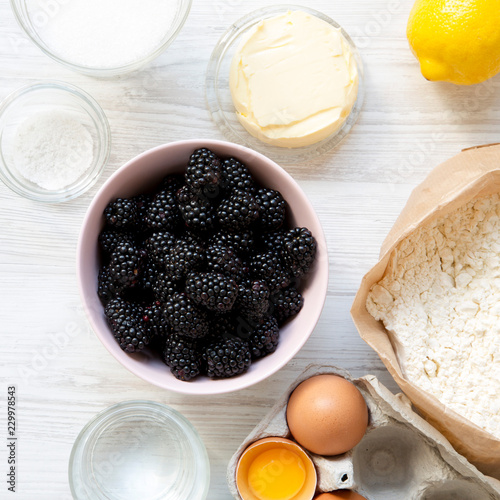 Flat lay of raw ingredients for cooking blackberry pie. Overhead, from above, top view. photo