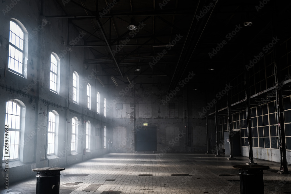 Ταπετσαρία Sunlight shining throuh the windows of an old abandoned industrial warehouse bui