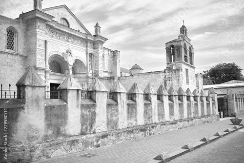 Side view of The Cathedral of Santa Maria la Menor in the Colonial Zone of Santo Domingo the capital of Dominican Republic. Photo is taken in sunny autumn day with small clouds the sky.