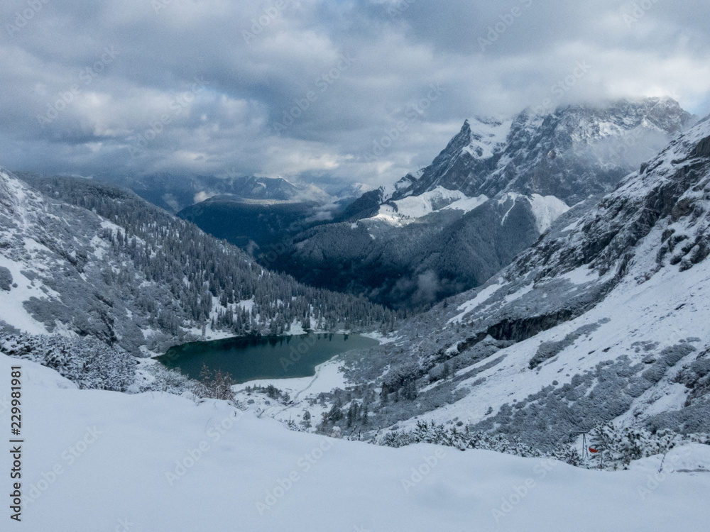turquoise colored alpine lake in winter