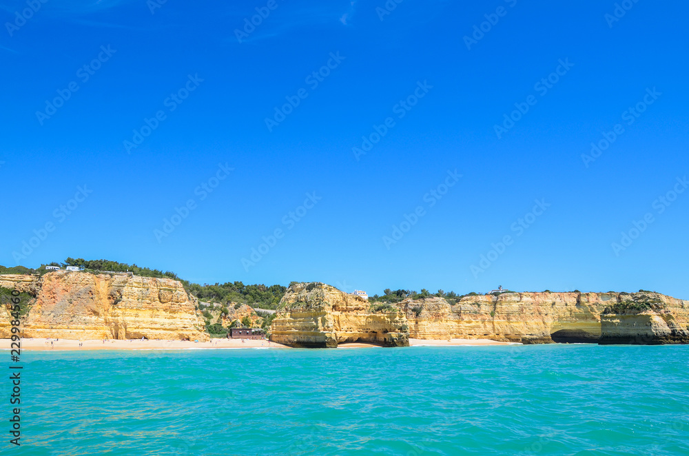 Cliffs and caves seen from the sea in Algarve region, Portugal