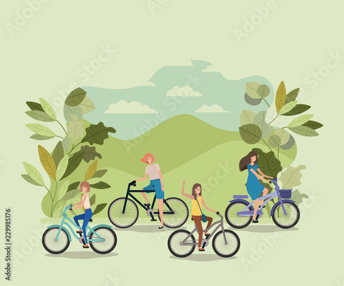 group of young women in bicycle on park