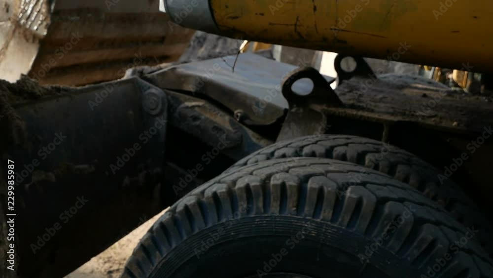 excavator at a construction site drives by camera. excavator at a construction site drives by camera.