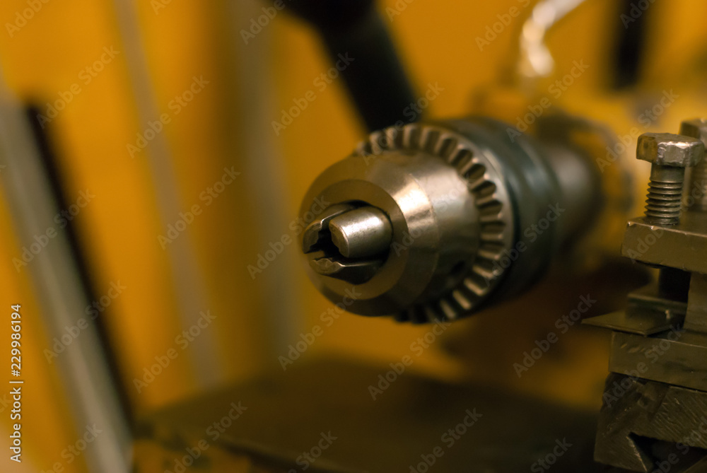 detail of the lathe - clamping chuck - close up on a blurred background detail of the lathe - clamping chuck - close up on a blurred background