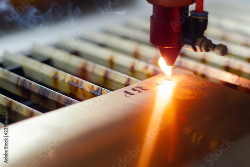 stage of manufacturing, laser engraving in automatic mode, close-up, blurred background