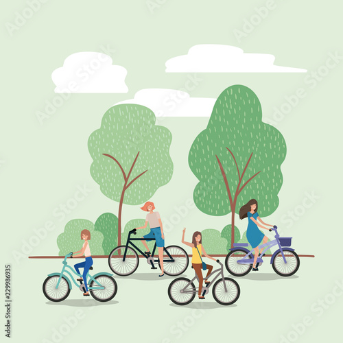 group of young women in bicycle on park