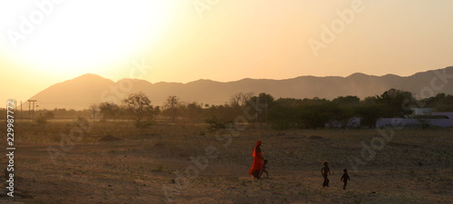 Indian woman with children in the Rajasthan desert