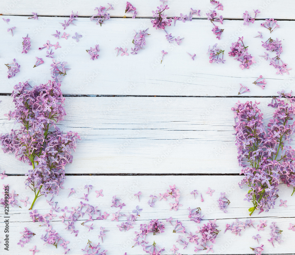 Bouquet of lilacs flowers on a light blue shabby wooden background. Vintage floral background with purple flowers. Copy space Bouquet of lilacs flowers on a light blue shabby wooden background. Vintage floral background with purple flowers. Copy space