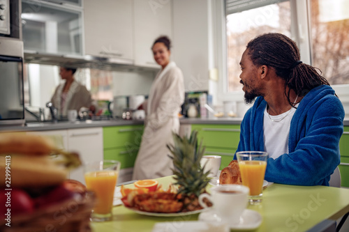 Afro American couple in kitchen breakfast