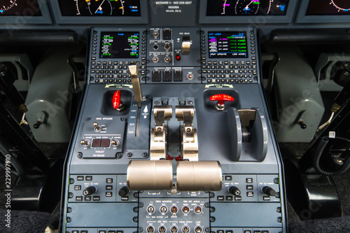 Closeup high detailed view on engine power control and other aircraft control unit in the cockpit of modern civil passenger airplane