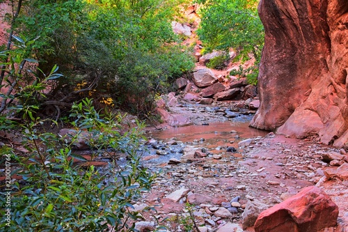 Kanarraville Falls, views from along the hiking trail of falls, stream, river, sandstone cliff formations Waterfall in Kanarra Creek Canyon by Zion National Park, Utah, USA. photo