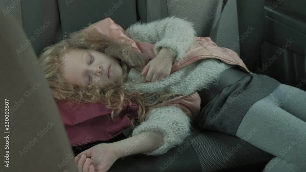 the little girl was sleeping in the car in the back the little girl was sleeping in the car in the back