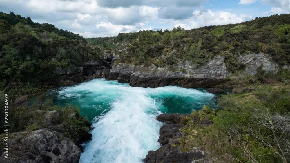 Fast moving water is released into a low level gorge, quickly forming water rapids. Time Lapse. Fast moving water is released into a low level gorge, quickly forming water rapids. Time Lapse.