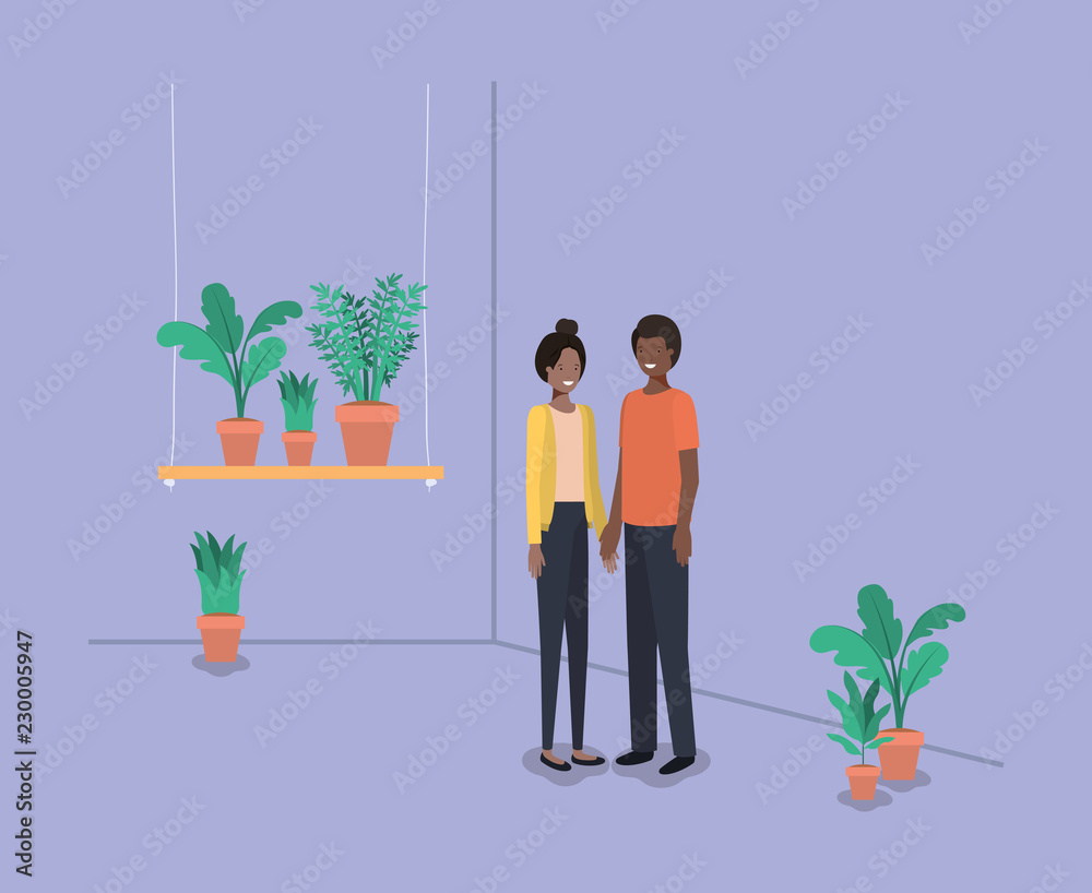 couple with houseplants in shelf couple with houseplants in shelf