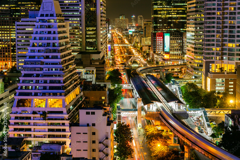 Fototapeta premium Cityscape Bangkok downtown at night, from the top of tower, Panorama view. and technique long exprosure and HDR filter. wealth of life concept. many lighting in the city.