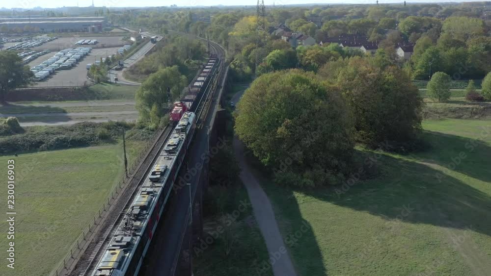 Freight Train Transporting Goods Across a Bridge For Logistics and Industry Freight Train Transporting Goods Across a Bridge For Logistics and Industry