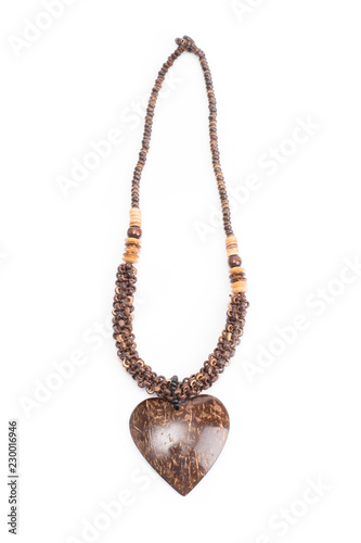 A handmade coconut shell necklace on a white background.