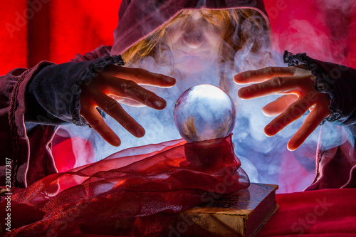 Fotografie a fortune teller reads from a crystal ball