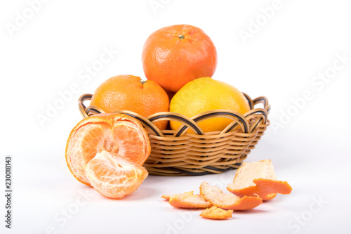 oranges in a basket isolated on white background