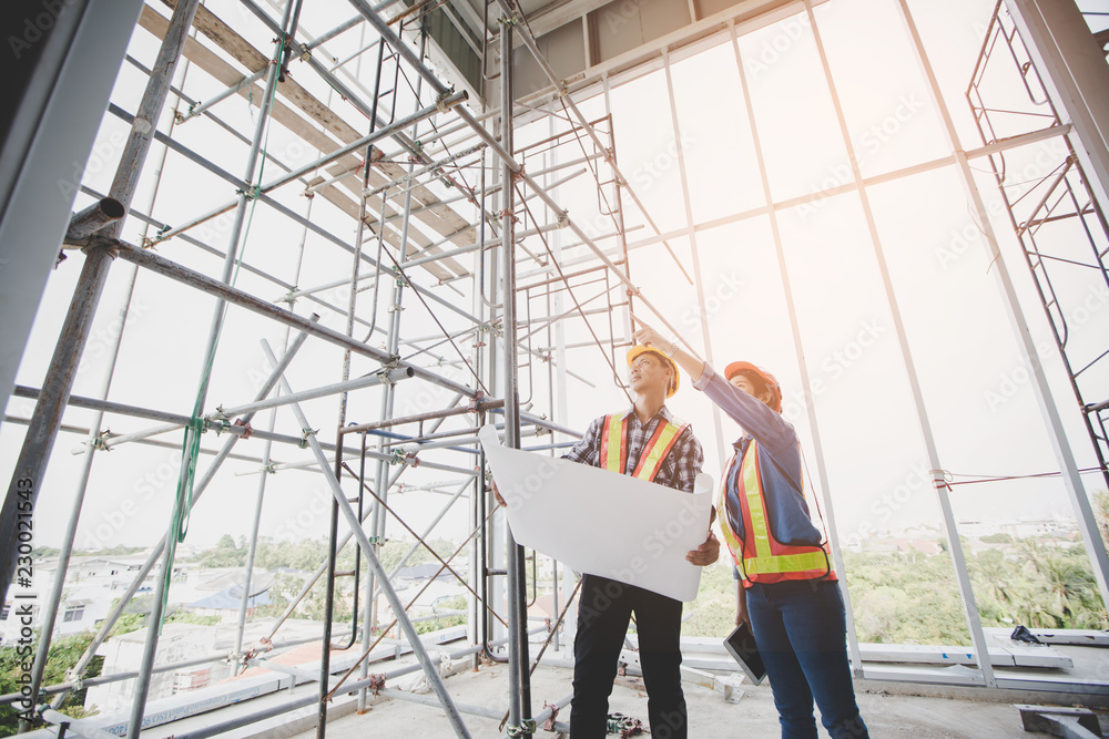 Ταπετσαρία Engineers are meeting and pointing to new construction sites, Engineering tools and construction concept