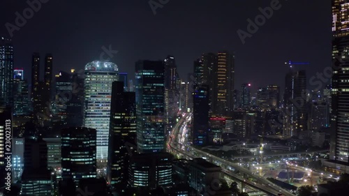 Wallpaper Mural JAKARTA, Indonesia - October 23, 2018: Beautiful aerial Jakarta skyline with skyscrapers and highway at nighttime. Shot in 4k resolution Torontodigital.ca