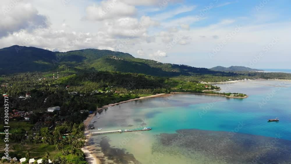 Aerial view of tropical sea and beach on white cloud and blue sky Aerial view of tropical sea and beach on white cloud and blue sky