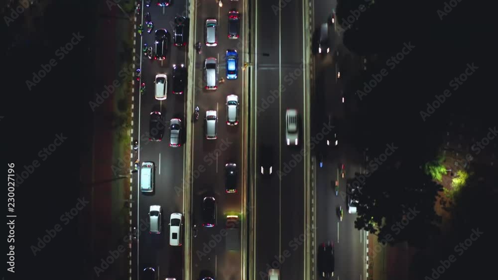 JAKARTA, Indonesia - October 23, 2018: Aerial shot of night traffic jam with vehicles moving slowly on the Casablanca street in Jakarta, Indonesia. Shot in 4k resolution JAKARTA, Indonesia - October 23, 2018: Aerial shot of night traffic jam with vehicles moving slowly on the Casablanca street in Jakarta, Indonesia. Shot in 4k resolution